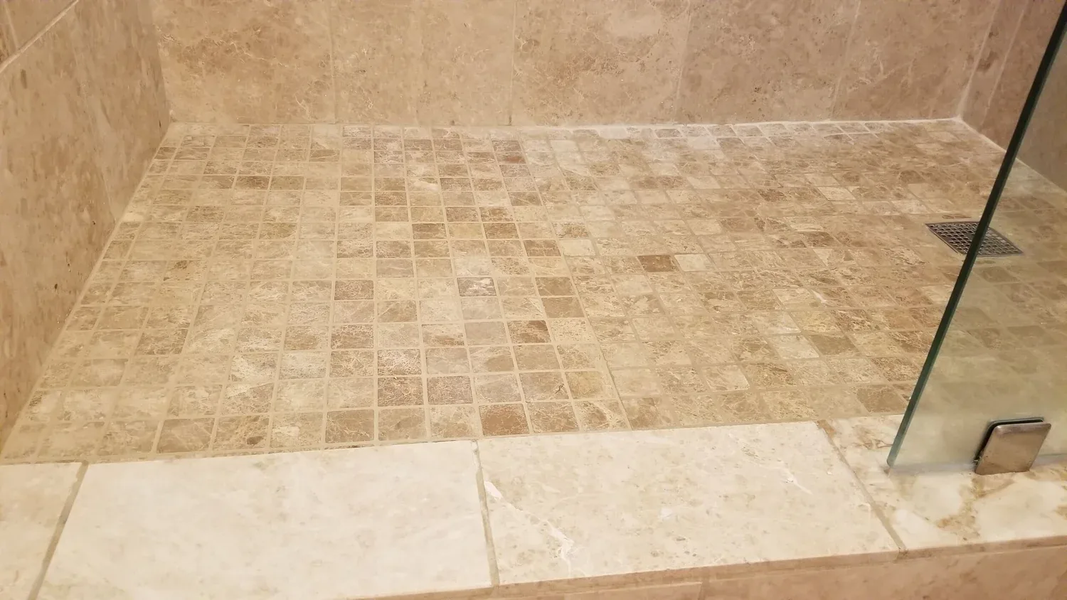 Travertine mosaic shower floor cleaned and restored by Grout Geek